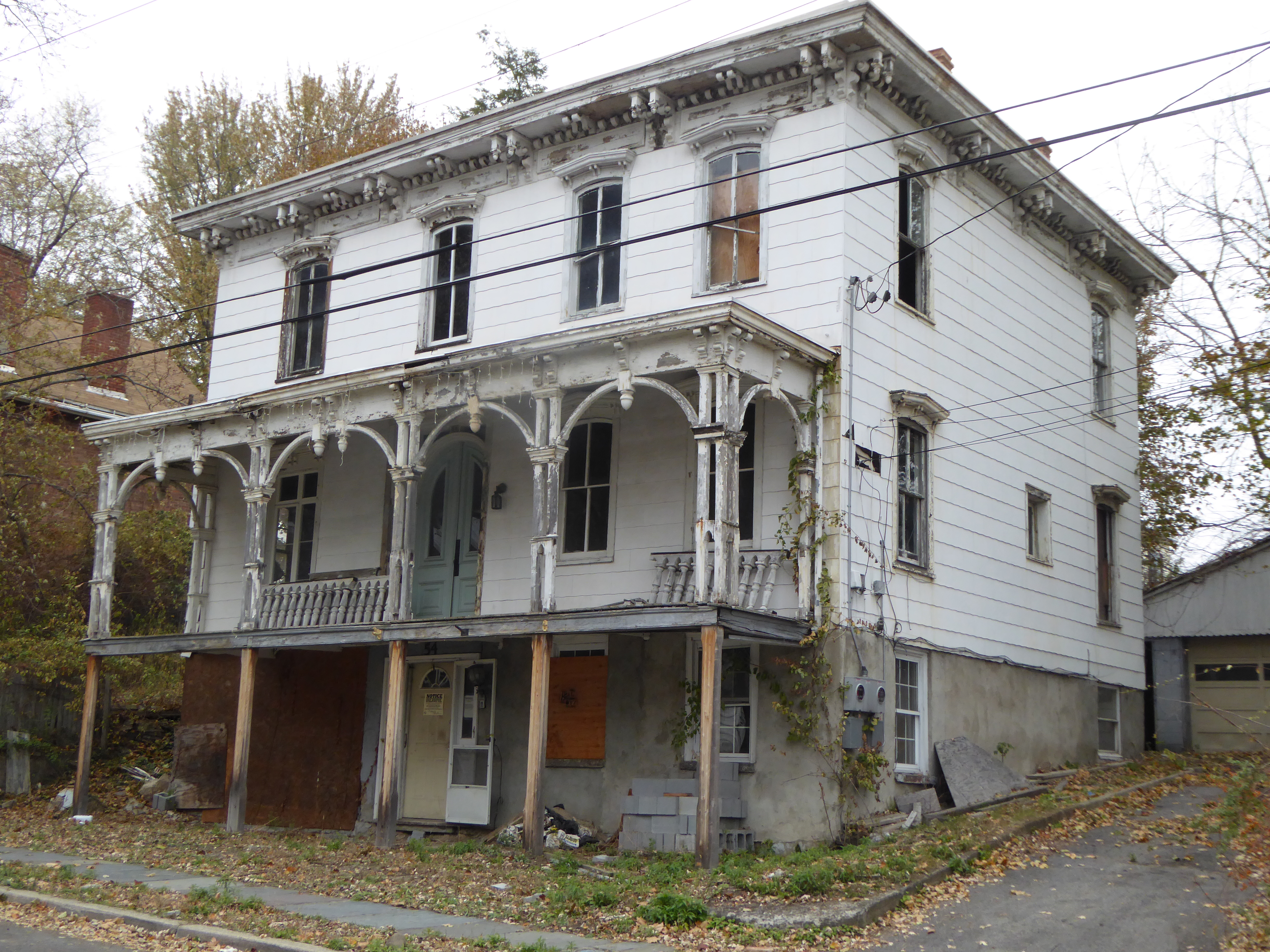 A beautiful old 3 story house with Italian styling. In need of much work